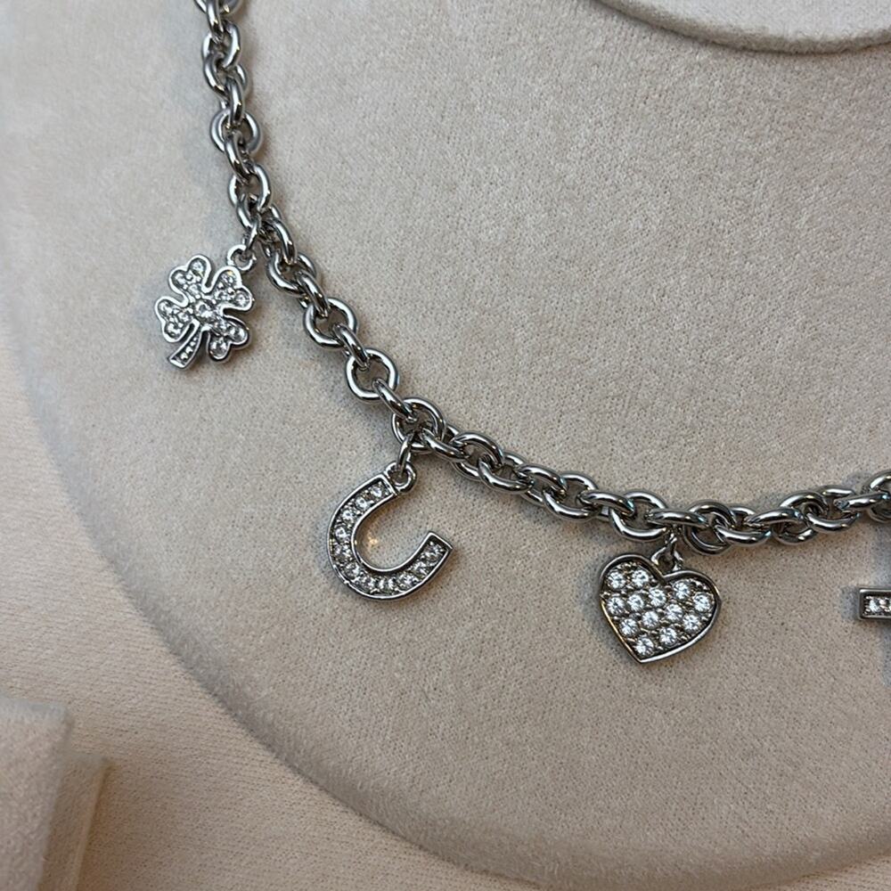 Nina Ricci Rhodium Plated Crystal Charm Necklace Heart Cross Star Horseshoe - Picture 3 of 4